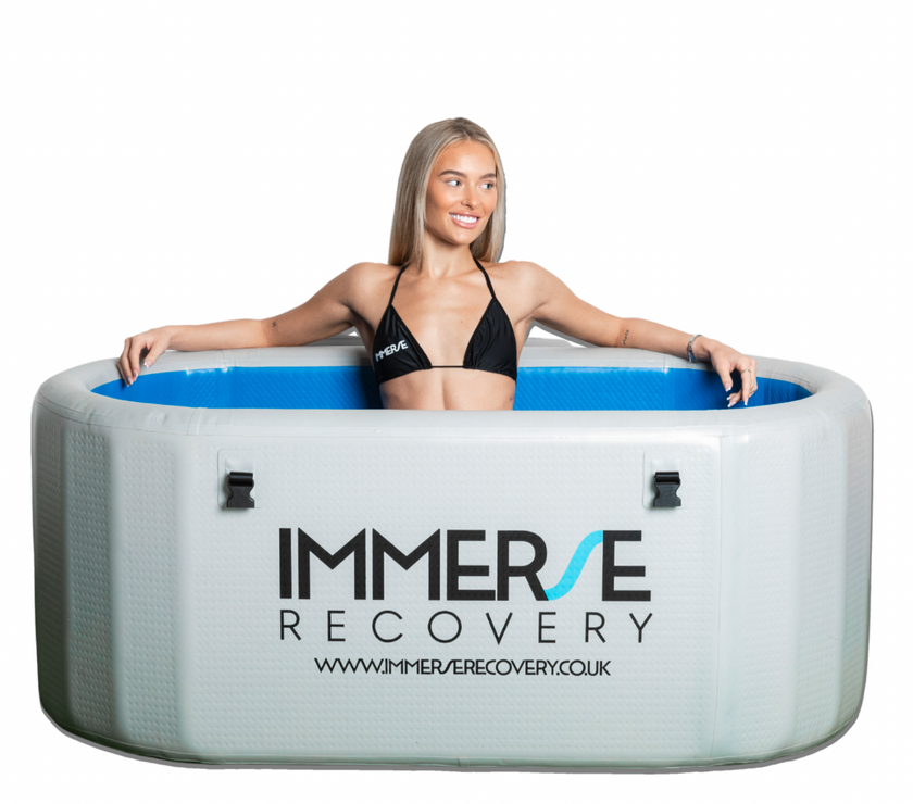 Professional cold plunge tub, ice bath, cold water therapy bath with women sat inside