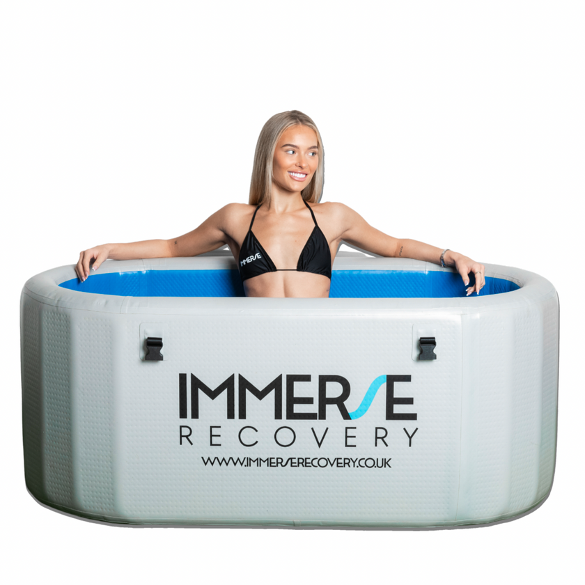 Professional cold plunge tub, ice bath, cold water therapy bath with women sat inside